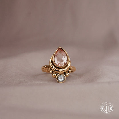 Handmade 24k yellow gold teardrop ring with morganite and aquamarine set in crescent-inspired form