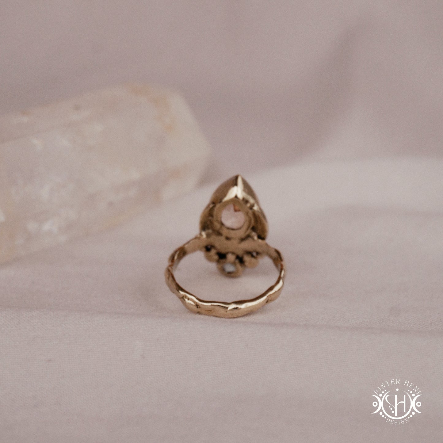Handmade brass teardrop ring with morganite and moonstone set in crescent-inspired form