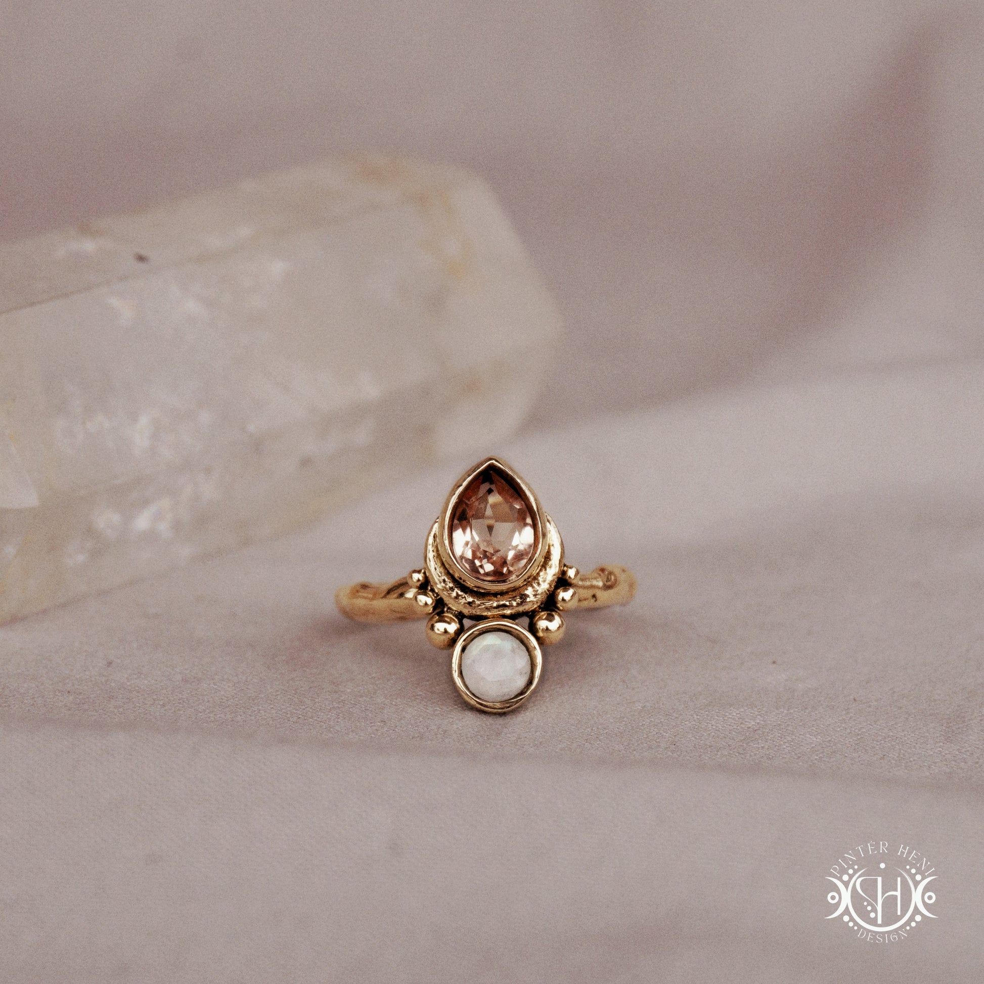 Handmade 24k yellow gold teardrop ring with morganite and moonstone set in crescent-inspired form