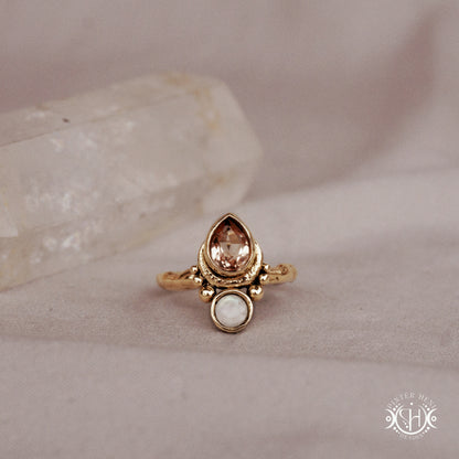 Handmade 24k yellow gold teardrop ring with morganite and moonstone set in crescent-inspired form