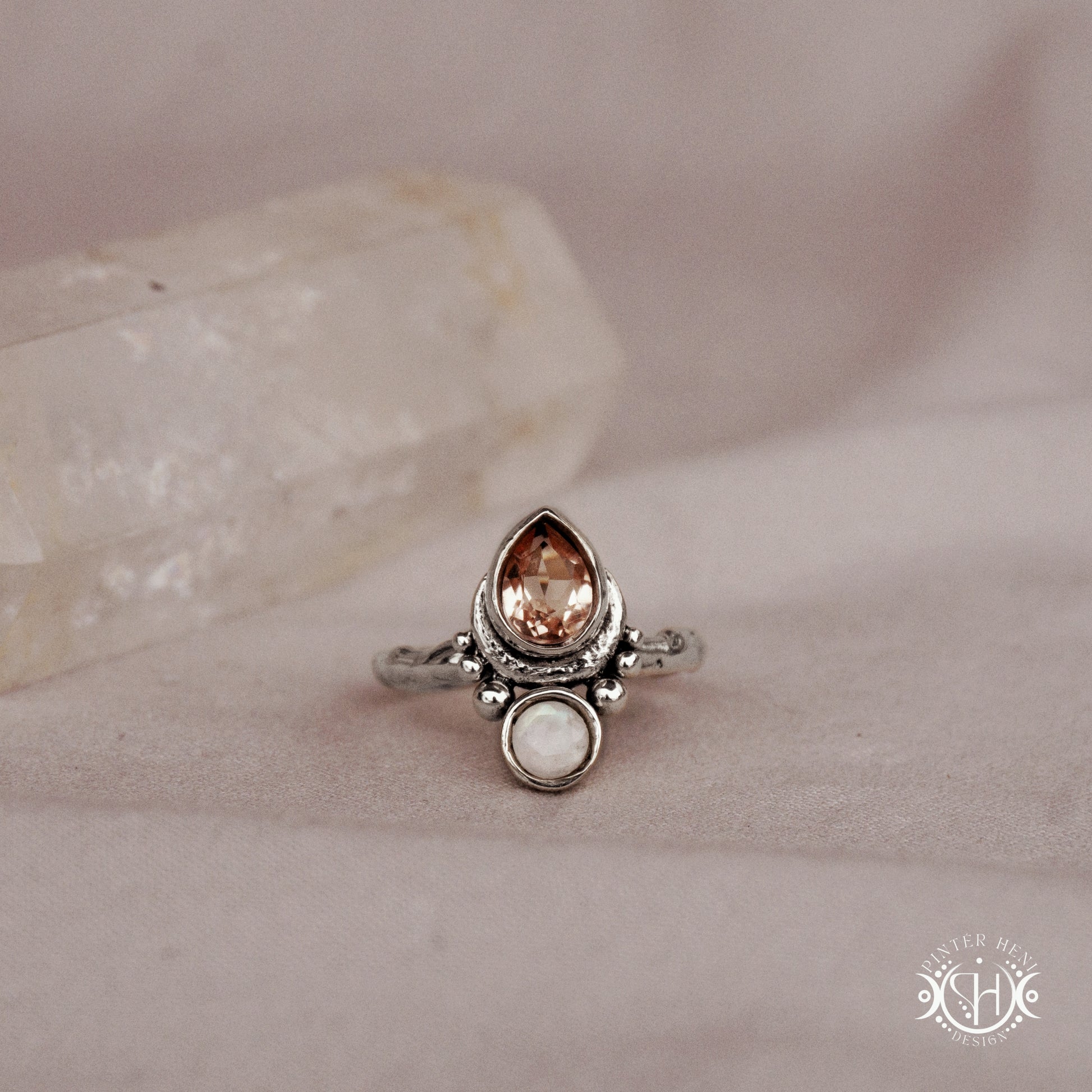 Handmade teardrop sterling silver ring with morganite and moonstone set in crescent-inspired form
