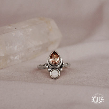 Handmade teardrop sterling silver ring with morganite and moonstone set in crescent-inspired form