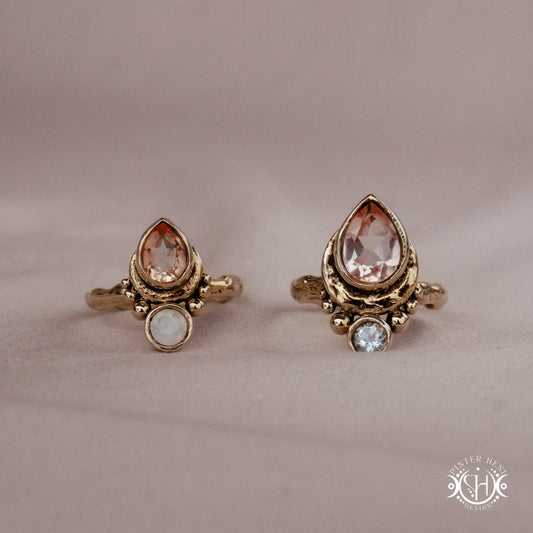 Handmade teardrop rings with morganite, moonstone and aquamarine set in crescent-inspired form