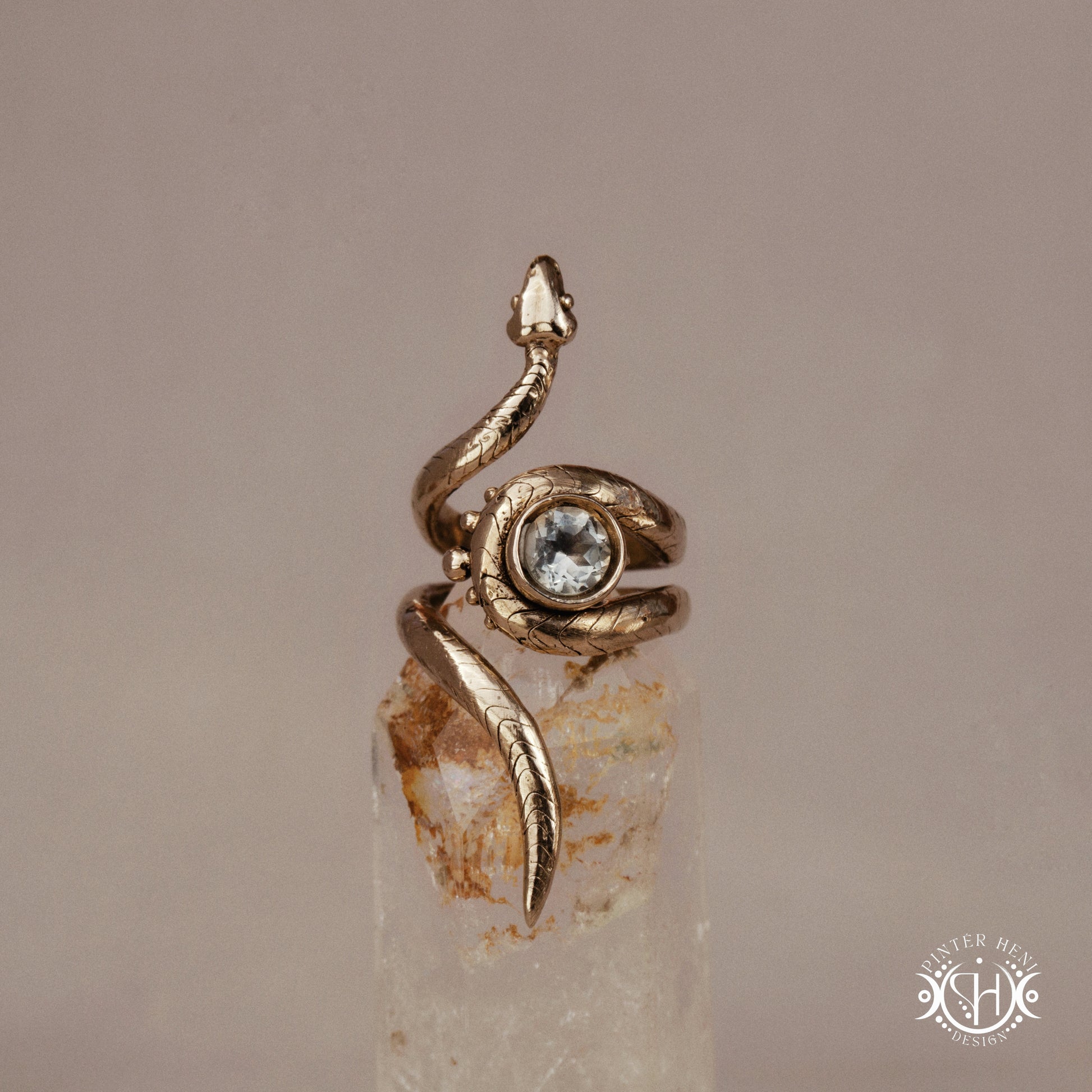 Handmade adjustable serpent ring set with prasiolite, sculptural wax carved design in brass, silver, or solid gold, on crystal.