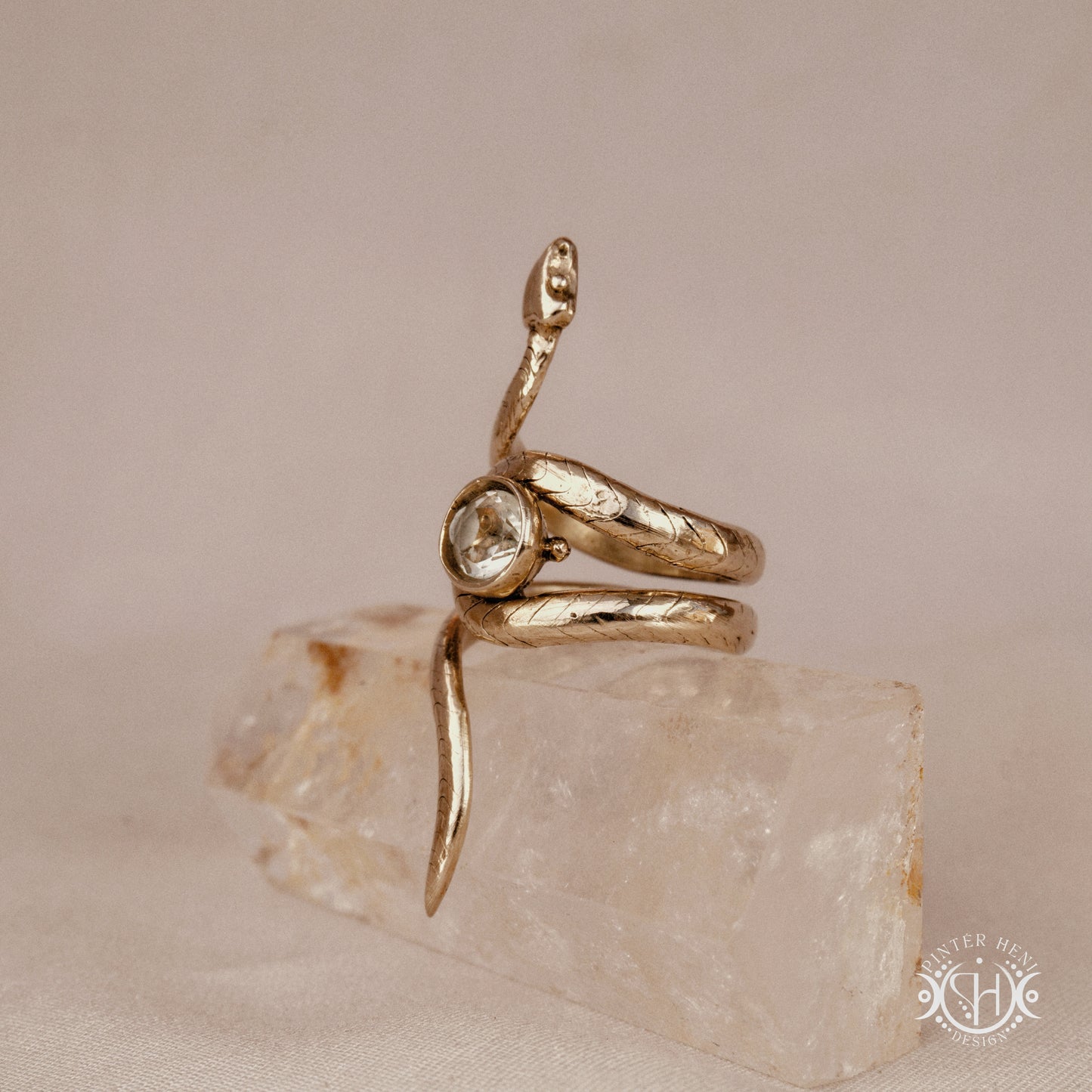 Handmade adjustable serpent ring set with prasiolite, sculptural wax carved design in brass, silver, or solid gold, side view.