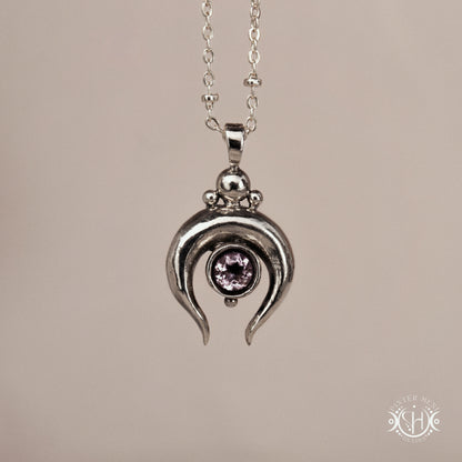 Hand-carved crescent moon pendant in sterling silver with amethyst from the Primal Symbols collection. Symbolic jewelry made to order in brass, silver, and gold.
