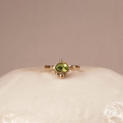Singularity Ring with centered stone and vertical bead alignment in handcrafted metal setting