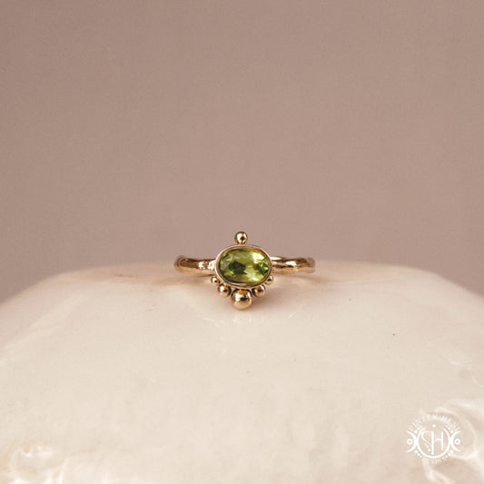 Singularity Ring with centered stone and vertical bead alignment in handcrafted metal setting