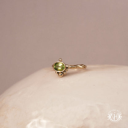 Singularity Ring with centered stone and vertical bead alignment in handcrafted metal setting