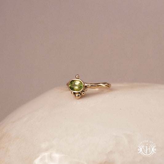 Singularity Ring with centered stone and vertical bead alignment in handcrafted metal setting