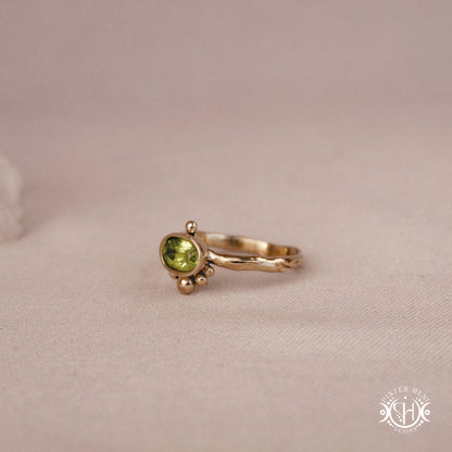 Singularity Ring with centered stone and vertical bead alignment in handcrafted metal setting