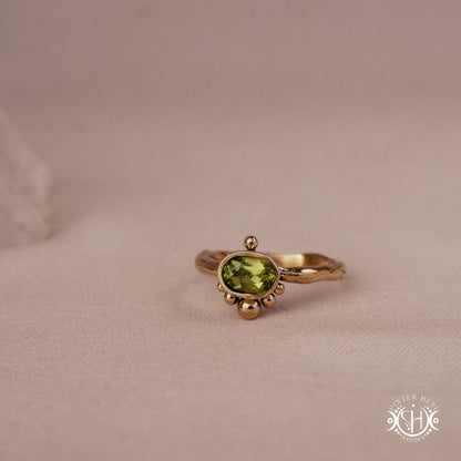 Singularity Ring with centered stone and vertical bead alignment in handcrafted metal setting