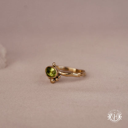 Singularity Ring with centered stone and vertical bead alignment in handcrafted metal setting