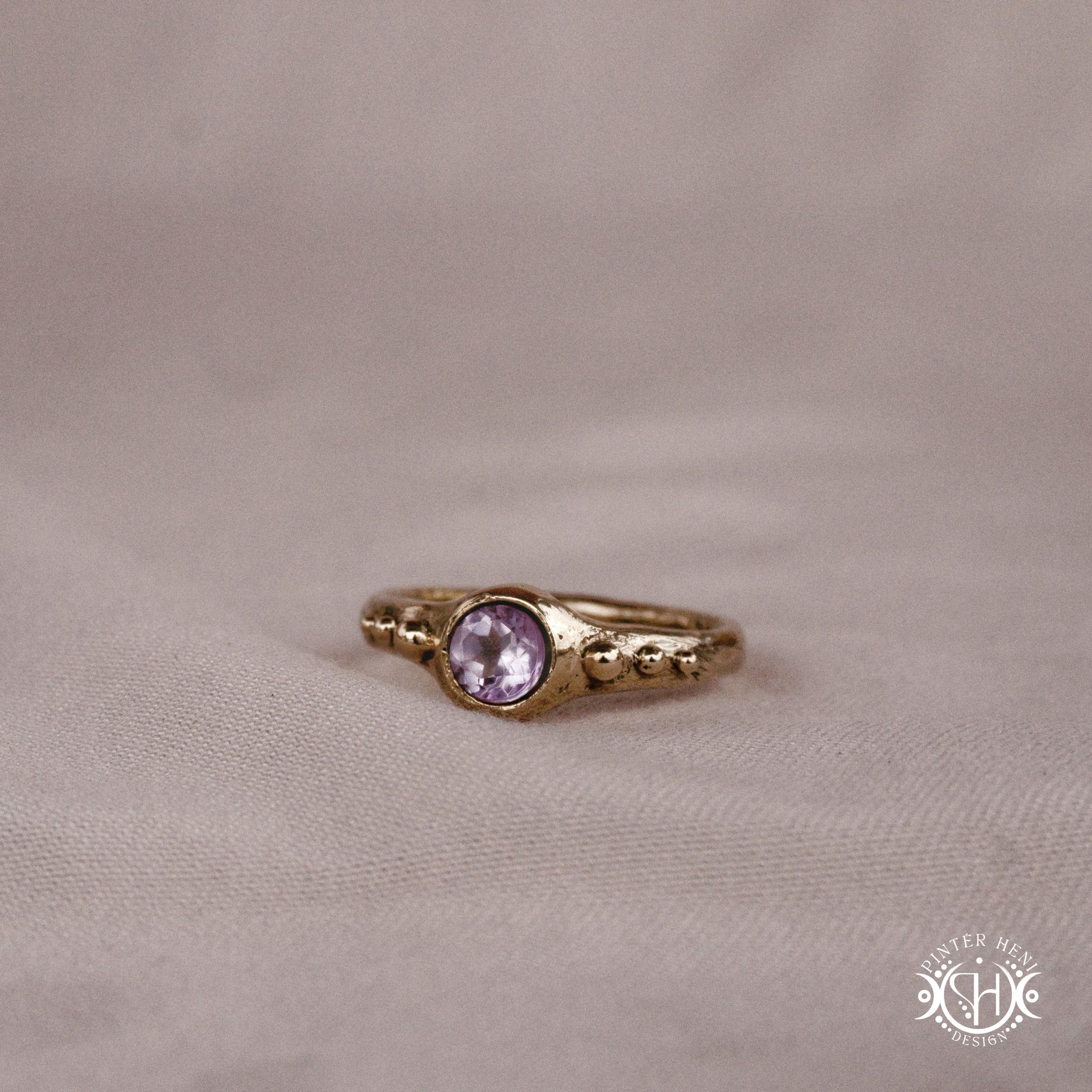 Star Cluster Ring with amethyst and surrounding bead details in handcrafted metal
