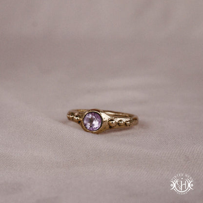 Star Cluster Ring with amethyst and surrounding bead details in handcrafted metal