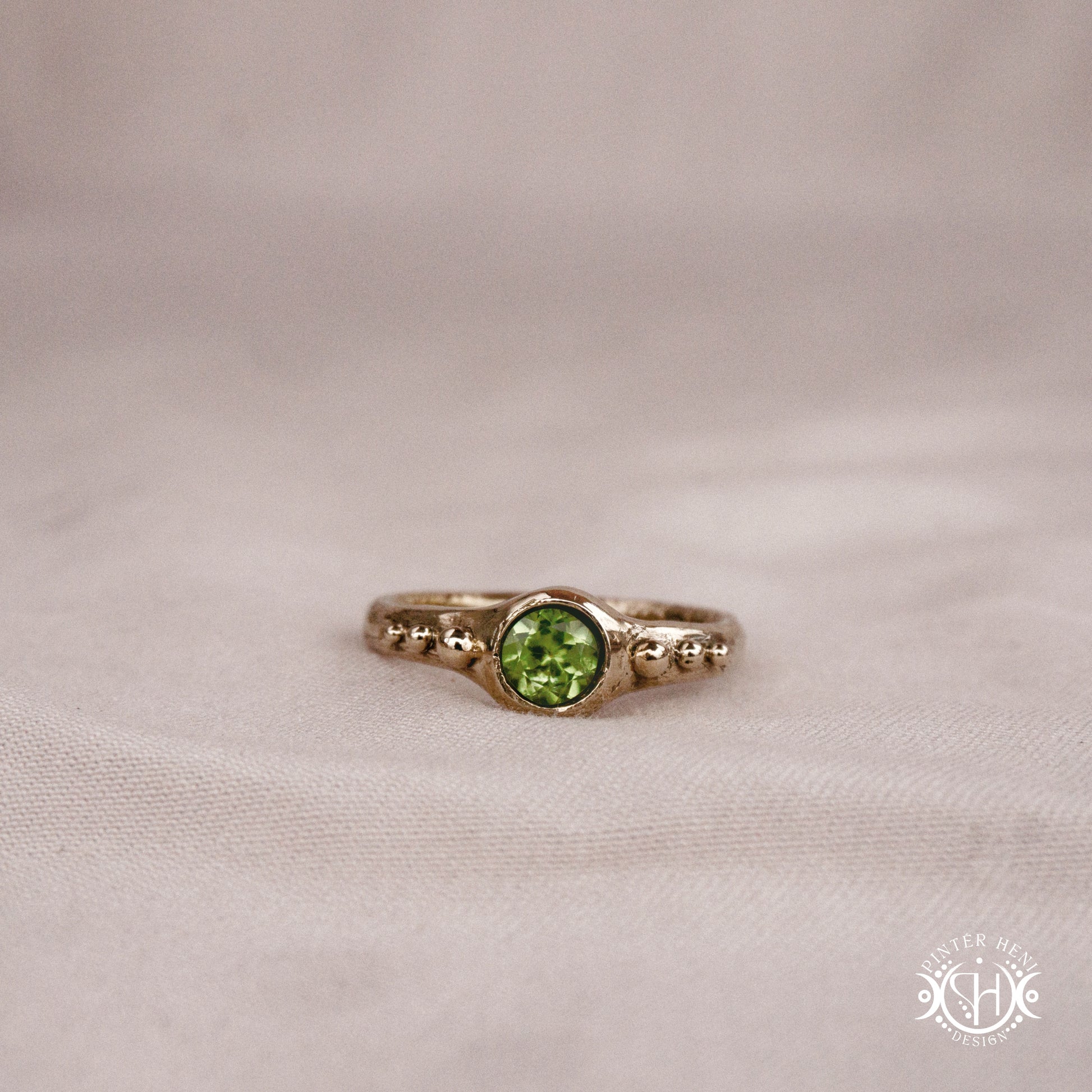 Star Cluster Ring with peridot and surrounding bead details in handcrafted metal
