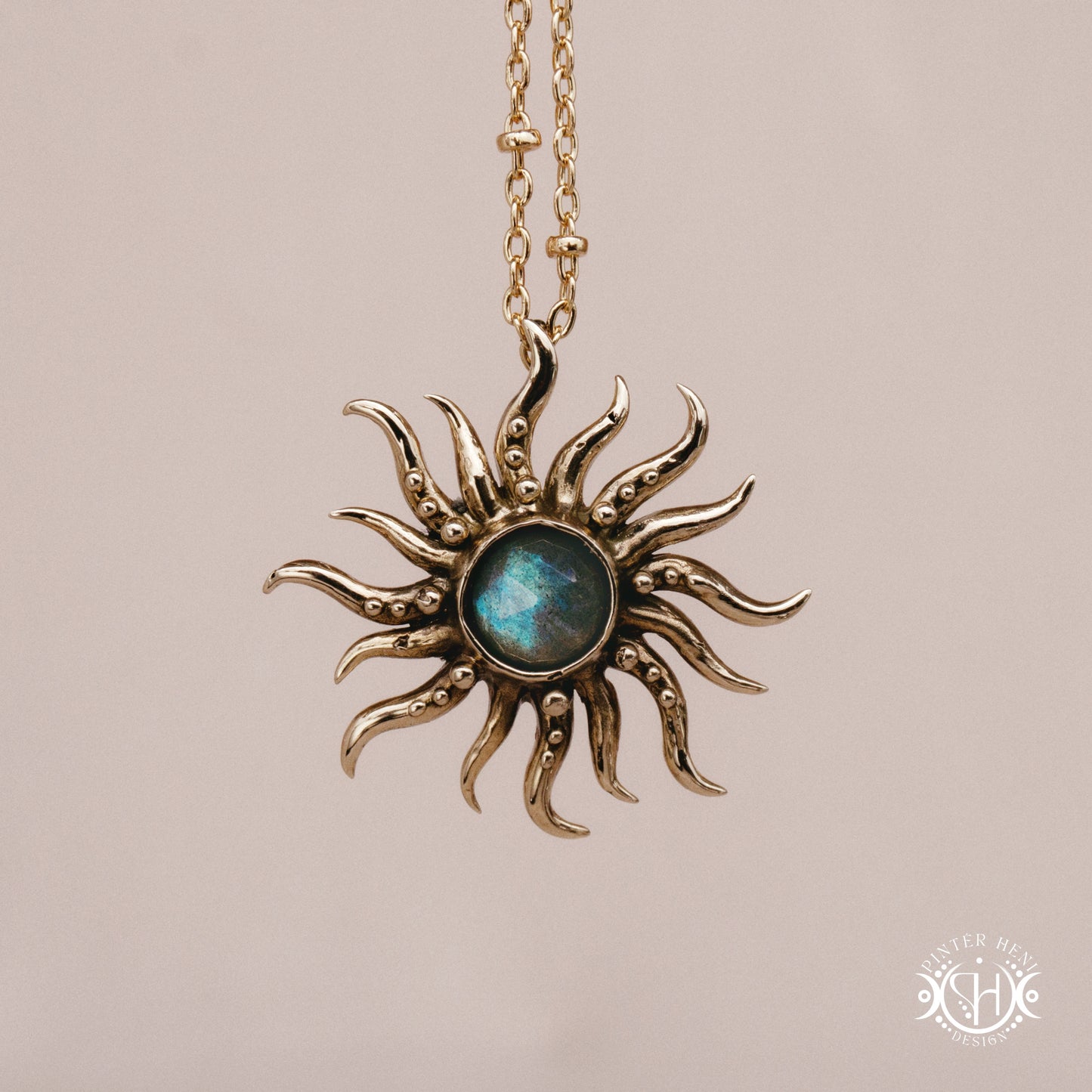 Hand-carved sun pendant in brass with organic rays from the Primal Symbols collection