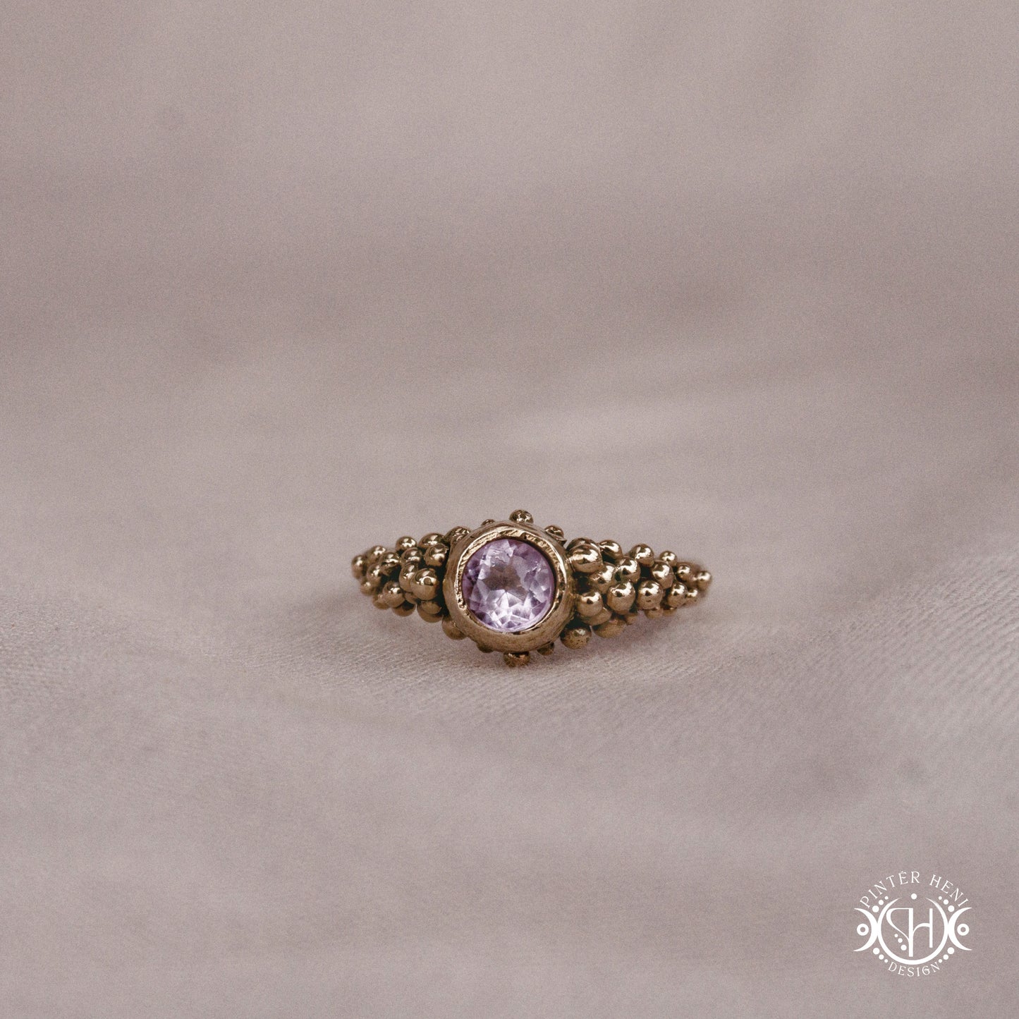 Supernova Ring with clustered bead texture forming an upper arc in handcrafted metal