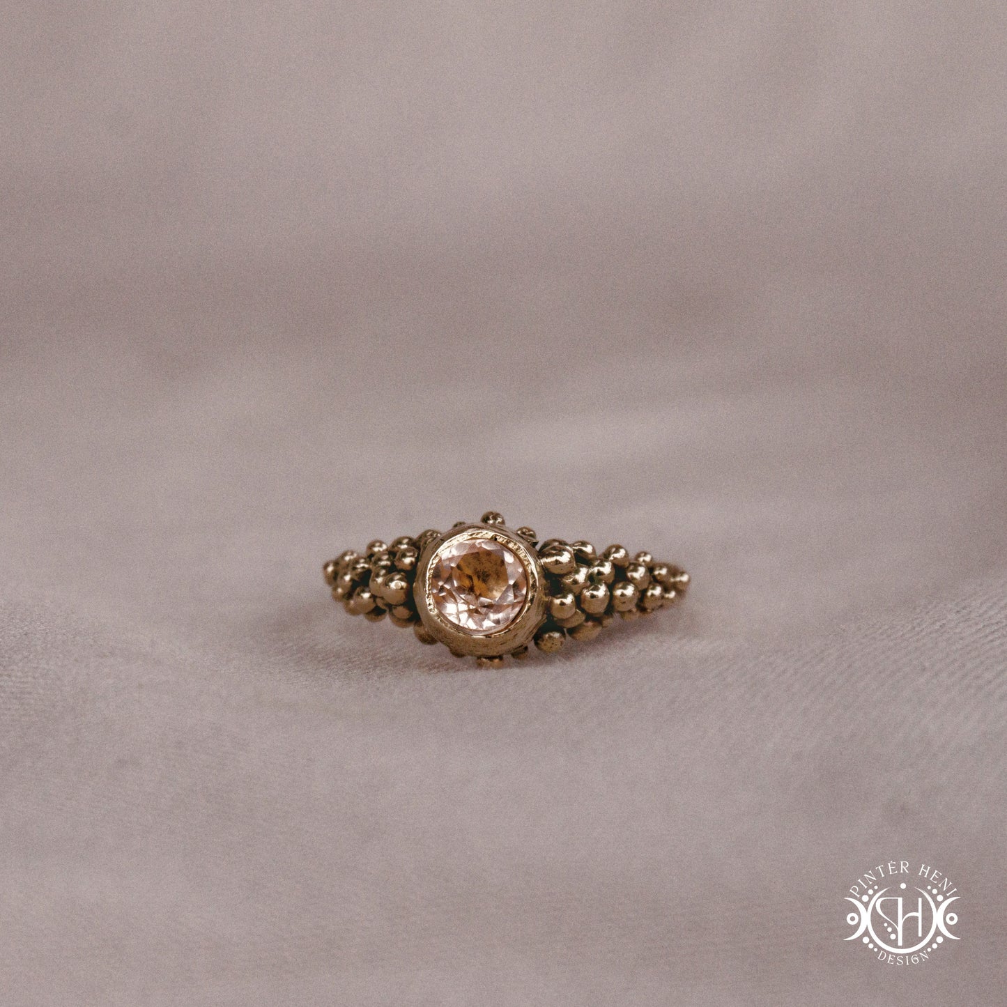 Supernova Core Ring with morganite and clustered bead texture forming an upper arc in handcrafted metal