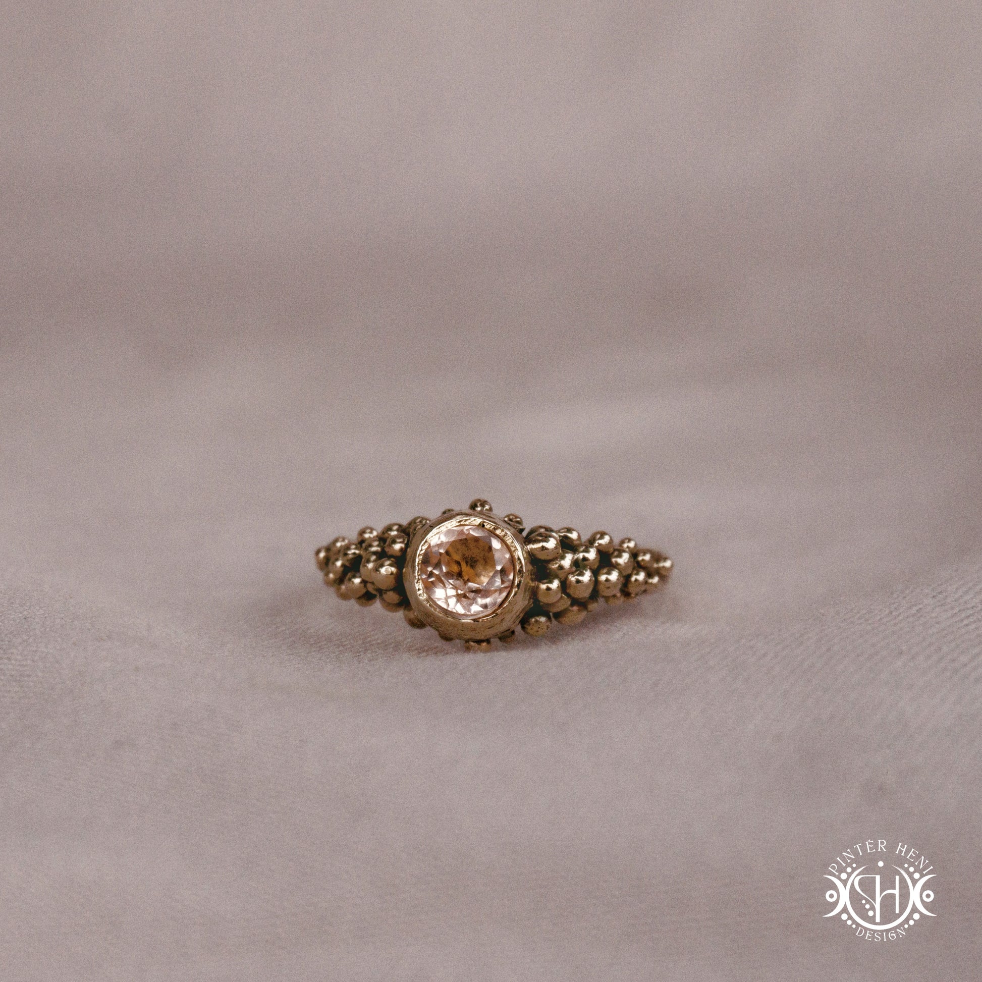 Supernova Core Ring with morganite and clustered bead texture forming an upper arc in handcrafted metal